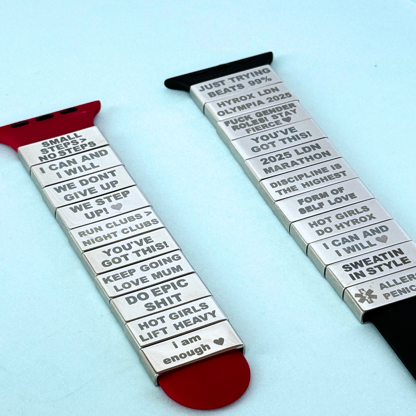 Multiple engraved Soltag motivational watch tags displayed on Apple Watch straps – custom fitness charm collection